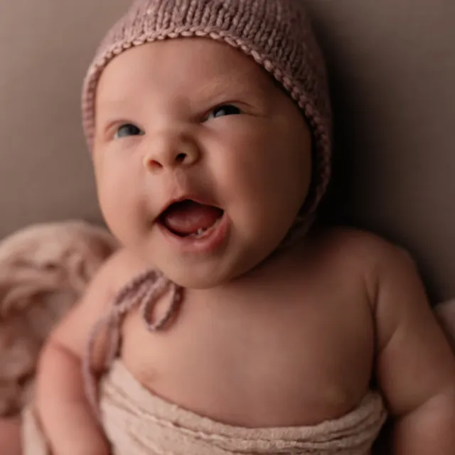 Baby Zoë smiling at the camera